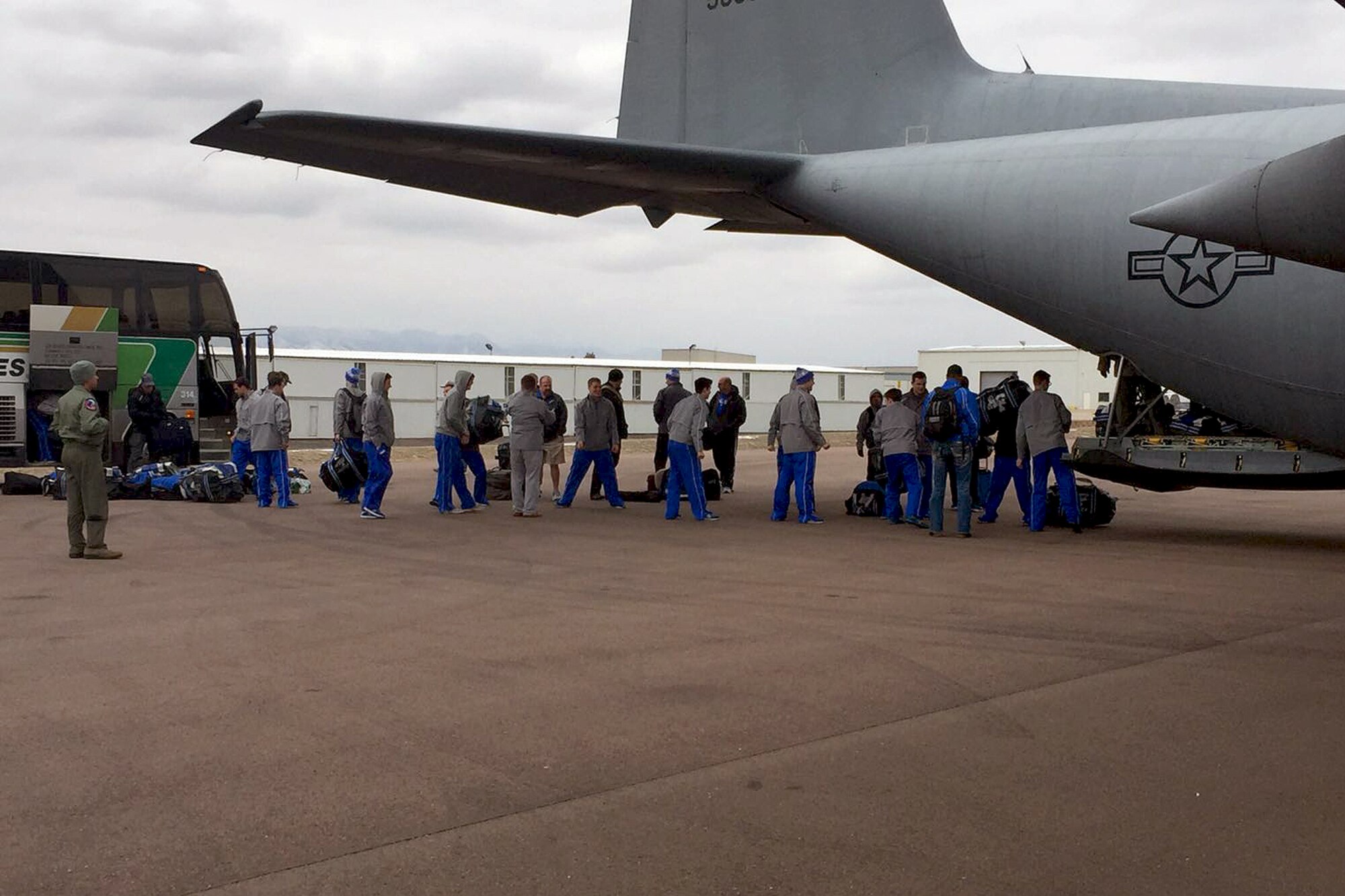 U.S. airmen of the 156th Operations Group, Puerto Rico Air National Guard, provide airlift transport on a WC-130 Hercules aircraft to the U.S. Air Force Academy ice hockey team from Rochester, N.Y. to Colorado Springs, Colo., Mar 19. As a unified team, the PRANG aircrew along with 47 Air Force Falcons team players and team personnel jointly loaded 3,000 pounds of hockey team equipment on the WC-130 for their 4 hours and 25 minutes flight to Colorado Spring. (U.S. Air National Guard photo by Maj. Luis Martinez)
