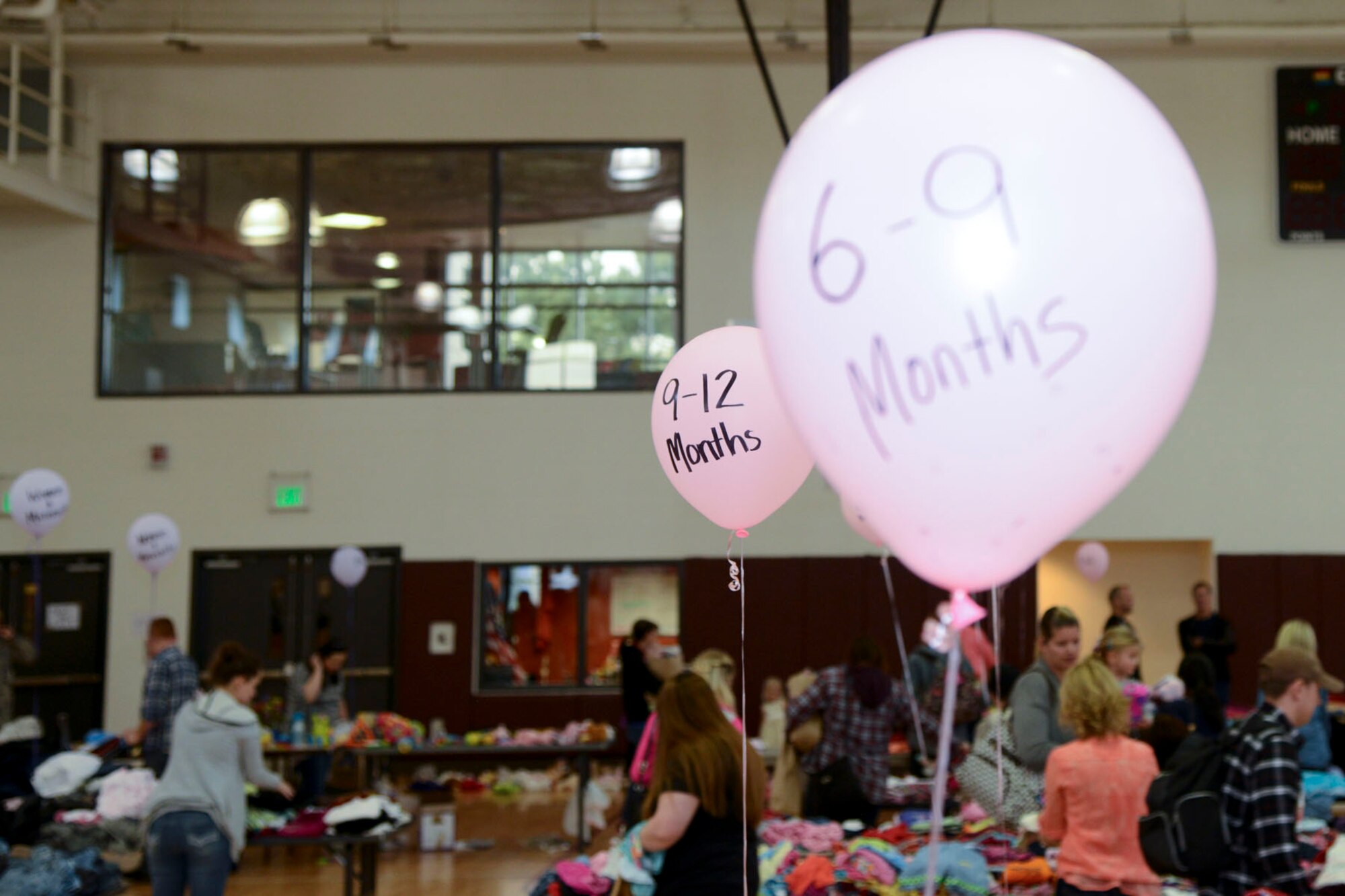 PETERSON AIR FORCE BASE, Colo. – Donated clothing was separated by size during the annual clothing swap at the Peterson Youth Center April 23, 2016. Volunteers began collecting items approximately a month prior to the event. (U.S. Air Force photo by Master Sgt. Jared Marquis)