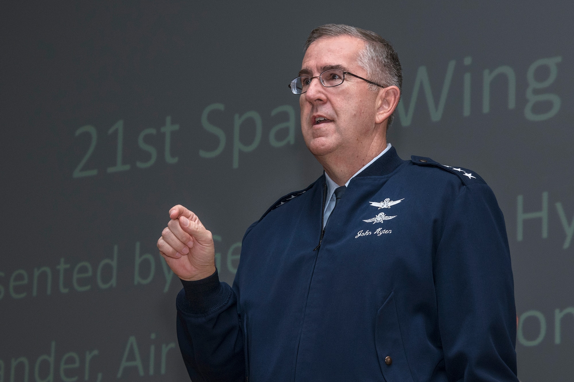 PETERSON AIR FORCE BASE, Colo. – Gen. John E. Hyten, Air Force Space Command commander discusses the history of the General Thomas S. Moorman Jr. Trophy with 21st Space Wing personnel after presenting the award to the 21st Space Wing on April 21, 2016 during the 21st Space Wing commander’s call. The Moorman Award recognizes the best overall wing in Air Force Space Command. (U.S. Air Force Photo by Craig Denton)