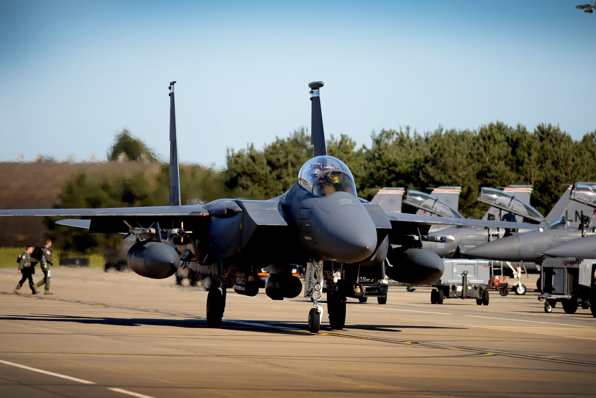 U.S. Air Force Capt. Nathan Janssen, 492nd Fighter Squadron pilot taxis his F-15E Strike Eagle for takeoff April 20, at Royal Air Force Lakenheath, England. Janssen and his crew conducted air-to-air fighter integration training with F-22 Raptors from the 95th Fighter Squadron which allows the legacy aircraft a unique opportunity to fly alongside the advanced fifth-generation aircraft while working with joint partners and NATO allies. (U.S. Air Force photo/ Tech. Sgt. Matthew Plew)