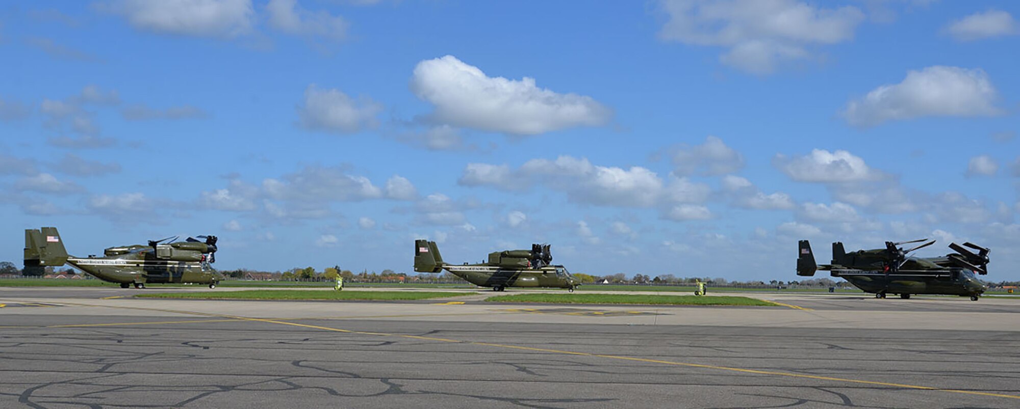 Three U.S. Marine Corps MV-22 Ospreys sit on the flightline April 19, 2016, on RAF Mildenhall, England. The multi-mission, tilt-rotor military aircraft, based out of Quantico, Va., were at RAF Mildenhall in support of the President’s visit to the United Kingdom for bilateral meetings and to the Hannover Messe being held in Germany. U.S. European Command and US Air Forces in Europe-Air Forces Africa were working with other government agencies in the U.K. and Germany to provide assistance as requested, to ensure a successful visit.  (U.S. Air Force photo by Karen Abeyasekere/Released)