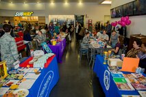 Spangdahlem community members engage in the Spring Fling event in the Base Exchange at Spangdahlem Air Base, Germany, April 15, 2016. Sensory activities promoted awareness of Exceptional Family Members and educated parents of the resources and activities available to aid them in attending their children’s special needs. (U.S. Air Force photo by Airman 1st Class Timothy Kim/Released)