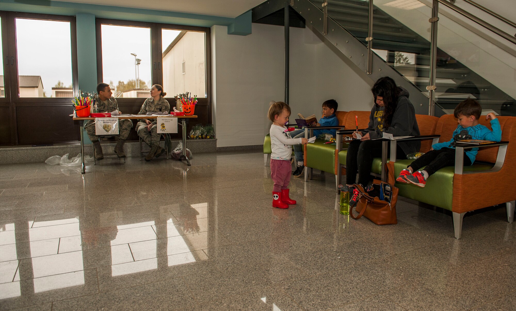 Family members of the 52nd Fighter Wing wait in the 52nd Dental Squadron’s lobby room during the dental clinic’s semi-annual children’s walk-in at Spangdahlem Air Base, Germany, April 22, 2016. Families received information regarding diets that contribute to healthy oral hygiene. (U.S. Air Force photo by Airman 1st Class Timothy Kim/Released)