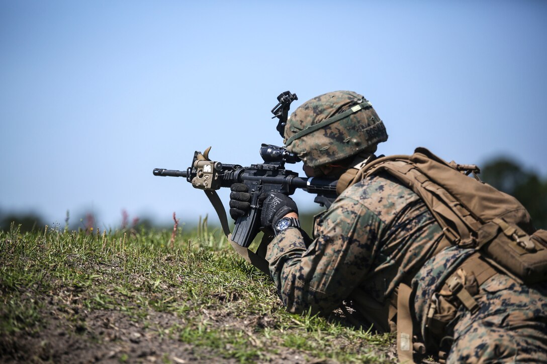 Lance Cpl. Michael A. Rosales, a machine gunner with Kilo Company, 3rd Battalion, 8th Marine Regiment, engages targets down range during a fire team attack exercise as part of the battalion field exercise at Camp Lejeune, N.C., April 26, 2016. The FEX, now in its final week of operations, previously tested Marines on basic infantry fundamentals such as patrolling and land navigation. (U.S. Marine Corps photo by Cpl. Paul S. Martinez/Released)