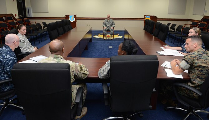 U.S. Army Sgt. Jacob Monroe, Task Force Talon prime power production specialist, front, answers questions from board members during a sexual assault prevention and response knowledge competition April 27, 2016, at Andersen Air Force Base, Guam. After review by board members, Monroe was announced the winner of the competition by proving knowledgeable about joint SAPR procedures. The event served to educate and promote awareness among service members assigned to Joint Region Marianas. (U.S. Air Force photo by Airman 1st Class Arielle Vasquez/Released) 