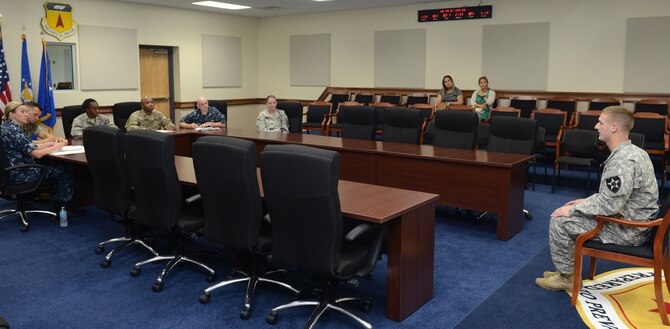 U.S. Army 1st Lt. Colin Hennessy, Task Force Talon, 2nd Infantry Division security forces platoon leader, right, answers questions from board members during a Sexual Assault Prevention and Response competition April 27, 2016, at Andersen Air Force Base, Guam. The nationally recognized SAPR event reinforced awareness of sexual assault and harassment within the military through healthy competition in a joint environment. (U.S. Air Force photo by Airman 1st Class Arielle Vasquez/Released)