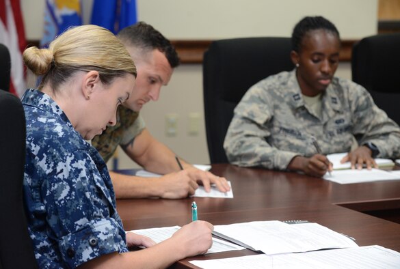 Board members listen to service members’ answers during a sexual assault prevention and response competition April 27, 2016, at Andersen Air Force Base, Guam. Joint SAPR experts hosted a competition during the Sexual Assault Awareness and Prevention Month to raise awareness about sexual assault and educate communities and individuals on how to prevent sexual violence. (U.S. Air Force photo by Airman 1st Class Arielle Vasquez/Released)