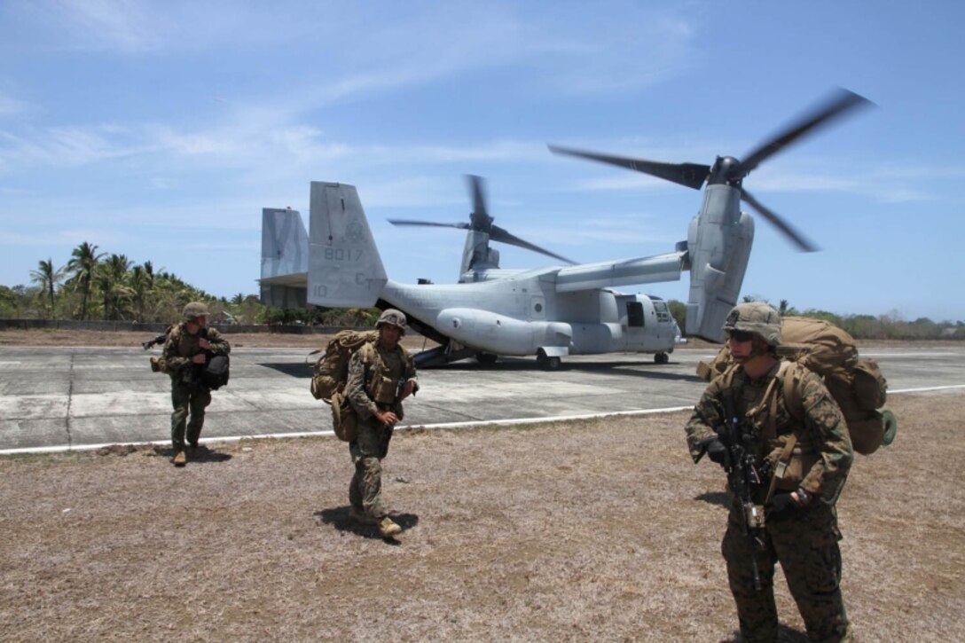 Marines disembark from an MV-22 Osprey after landing at an airstrip in Panay, Philippines, during Exercise Balikatan, Monday, April 11, 2016. The Marines were acting as a follow-up force for an earlier amphibious landing by Filipino marines. 