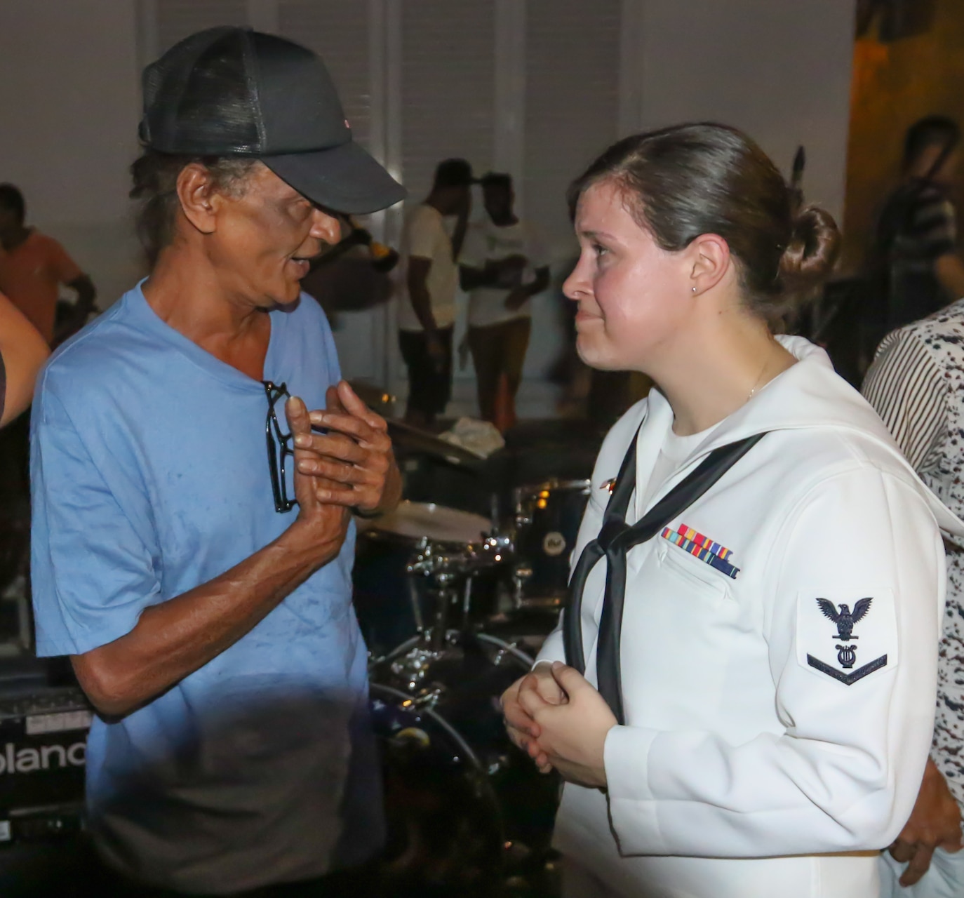 COLUMBO, Sri Lanka (Mar. 27, 2016) Musician 3rd Class Emily Kershaw, of the U.S. 7th Fleet Band, speaks with Senaka Batagoda, the artist who wrote the song “Api Kawuruda,” following Kershaw's performance of the song at Dutch Hospital in Columbo, Sri Lanka. The U.S. 7th Fleet conducts forward-deployed naval operations in support of U.S. national interests in the Indo-Asia-Pacific area of operations. (U.S. Navy photo by Chief Mass Communication Specialist Hendrick Simoes/Released)