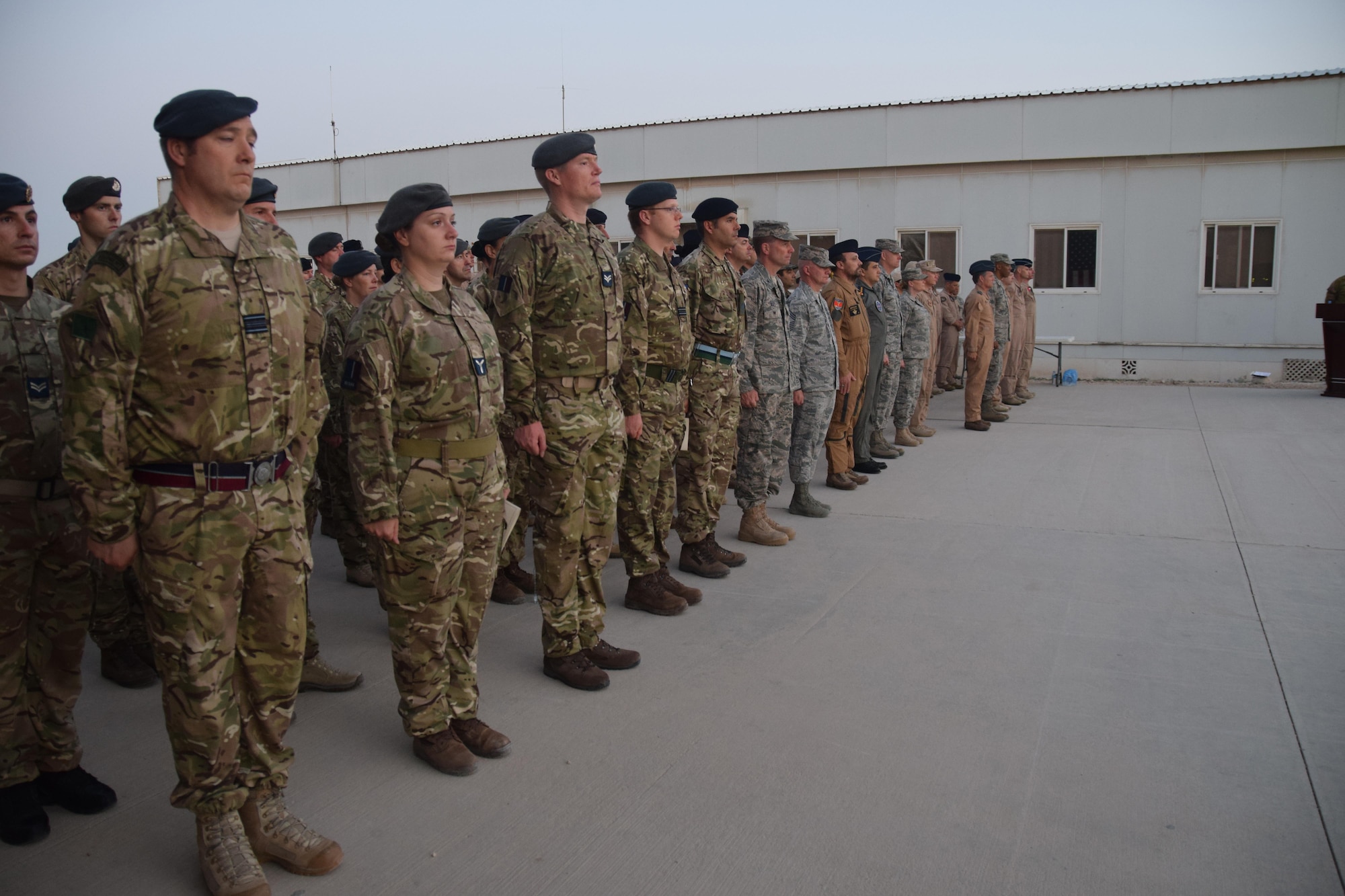 Military members from five coalition nations and the United States assembled for ANZAC Day, which began at dawn at an undisclosed location in Southwest Asia on April 25, 2016. Australian and New Zealand Army Corps forces quickly became known as Anzacs, and the pride they took in that name endures to this day according to the Australian War Memorial website. (U.S. Air Force photo by Tech. Sgt. Carlos J. Trevino/Released)

