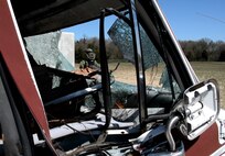 Staff Sgt. John Nelson, 512th Explosive Ordnance Flight, emerges from a secure detonation area after simulating removal of a mock improvised explosive device during a training exercise April 3, 2016 at Dover Air Force Base, Delaware. The bomb suit Nelson wore weighs approximately 85 lbs and is designed to provide the wearer the highest degree of protection and operational flexibility. (U.S. Air Force photo/Staff Sgt. Joe Yanik)