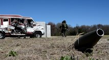 Staff Sgt. John Nelson, 512th Explosive Ordnance Flight, approaches the secure detonation area on the training site during an exercise while wearing an EOD 9 bomb suit April 3, 2016 at Dover Air Force Base, Delaware. For EOD technicians, like Nelson, safety is the most important aspect of training with explosive materials. (U.S. Air Force photo/Staff Sgt. Joe Yanik)