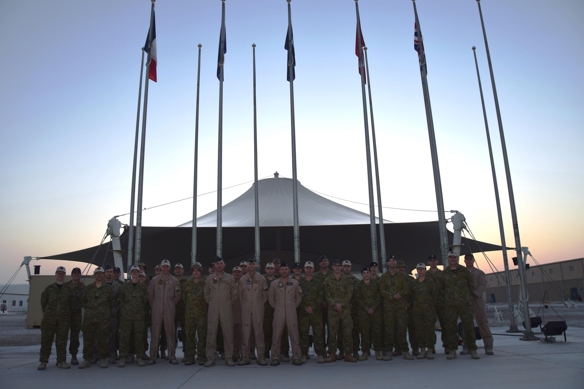 Members of the Australian and New Zealand armed forces pose for a photo on April 25, 2016, after the ceremony commemorating ANZAC Day at an undisclosed location in Southwest Asia.  It is similar to Memorial Day in the United States and honors military members both past and present in the Australian and New Zealand armed forces. (U.S. Air Force photo by Tech. Sgt. Carlos J. Trevino/Released)