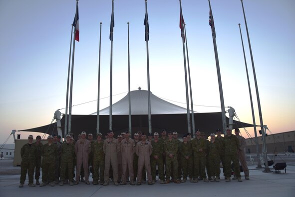 Members of the Australian and New Zealand armed forces pose for a photo on April 25, 2016, after the ceremony commemorating ANZAC Day at an undisclosed location in Southwest Asia.  It is similar to Memorial Day in the United States and honors military members both past and present in the Australian and New Zealand armed forces. (U.S. Air Force photo by Tech. Sgt. Carlos J. Trevino/Released)