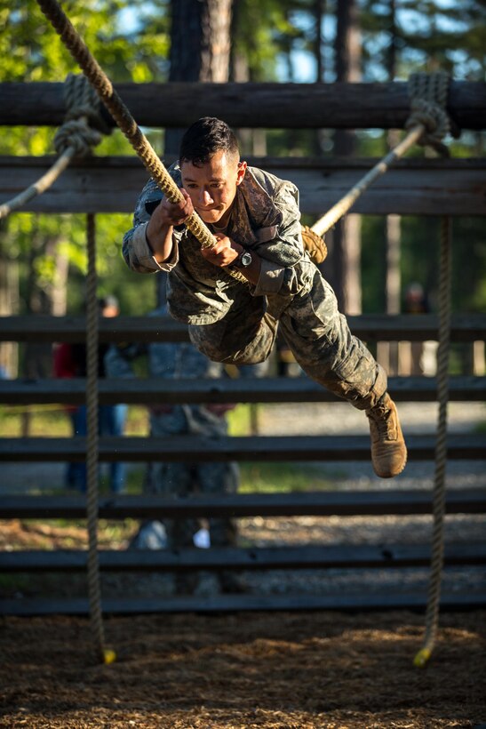 Army 1st Lt. Gunther Wong navigates a rope obstacle on the Darby Queen obstacle course during the Best Ranger competition at Fort Benning, Ga., April 17, 2016. Wong is assigned to the 25th Infantry Division. Army photo by Spc. Steven Hitchcock