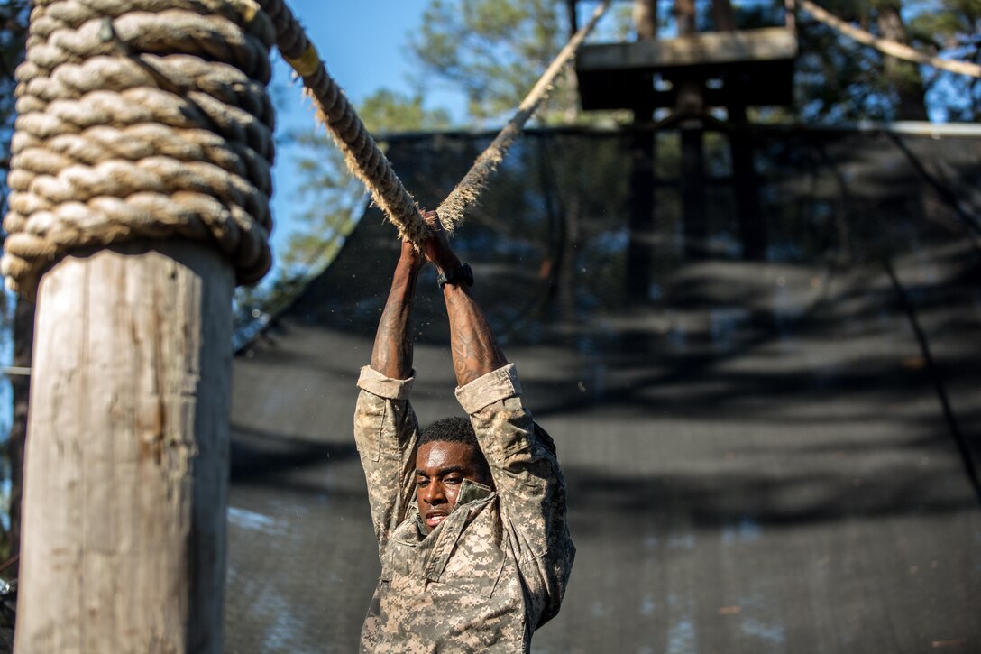 Army Sgt. Sheldon Evans moves on a rope at the Darby Queen obstacle course during the Best Ranger Competition 2016 at Fort Benning, Ga., April 17, 2016. Evans is assigned to the 75th Ranger Regiment. Army photo by Spc. Steven Hitchcock 