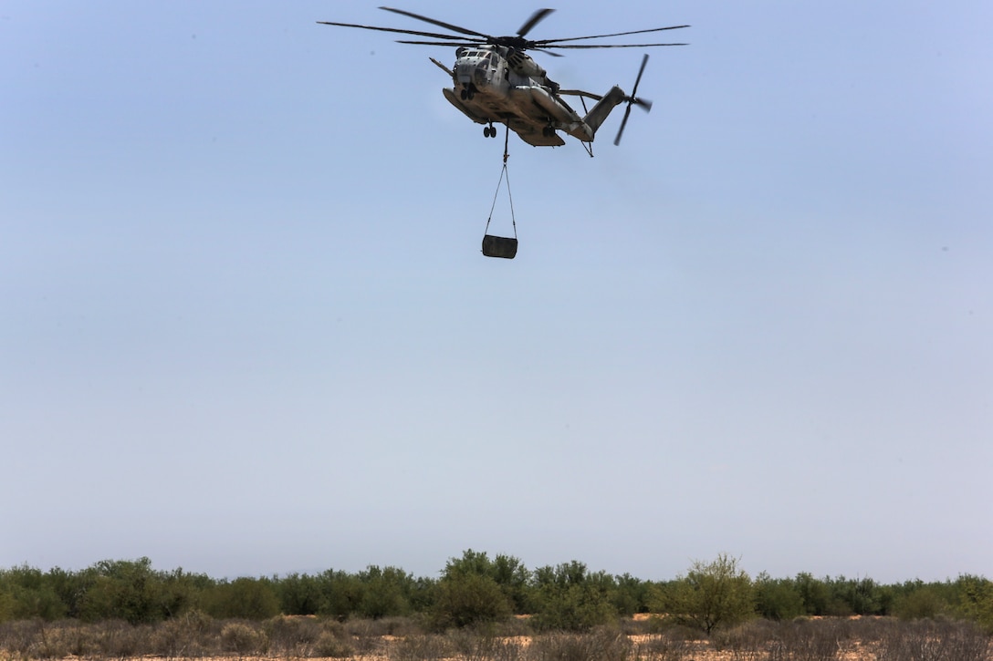 A Marine Corps CH-53E Super Stallion helicopter transports 500 gallons of fuel during Final Exercise 3 for the Weapons and Tactics Instructor course 2-16 at Stoval Airfield, near Yuma, Ariz., April 23, 2016. Marine Corps photo by Lance Cpl. Zachary M. Ford