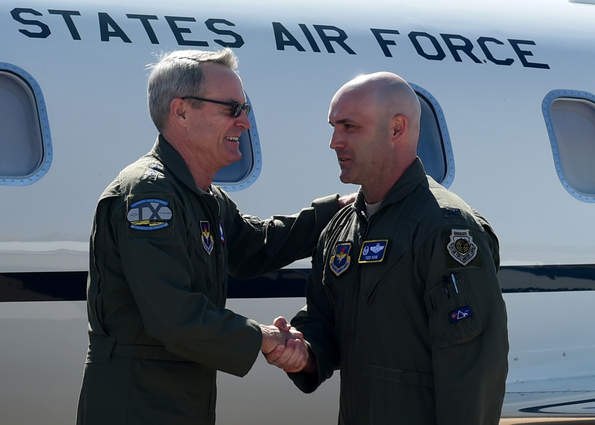 U.S. Air Force Lt. Gen. Darryl Roberson, commander of Air Education and Training Command, is greeted on the flightline, by U.S. Air Force Col. Todd Hohn, 97th Air Mobility Wing commander, April 25, 2016 at Altus Air Force Base, Okla. Roberson visited Altus AFB to gain a better understanding of the base’s training mission and discuss Air Force topics, including the U.S. Air Force KC-46 Pegasus, the importance of AETC missions and the need for innovation in the U.S. Air Force. (U.S. Air Force photo by Airman 1st Class Kirby Turbak/Released)
