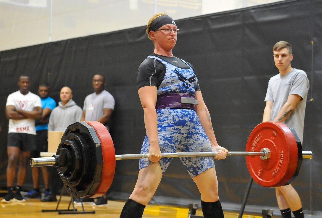 Air Force Staff Sgt. April Spilde competes in the deadlift portion of the push, pull and curl competition at Joint Base Myer-Henderson Hall in Washington, April 9, 2016. Spilde finished second in her weight class, deadlifting 300 pounds, bench-pressing 175 pounds and curling 75 pounds. Navy photo by Petty Officer 2nd Class Christopher Hurd