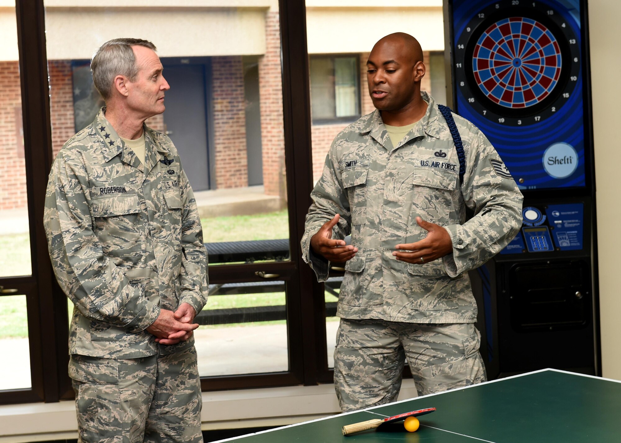 U.S. Air Force Tech. Sgt. Mark Smith, 97th Training Squadron military training leader, explains the improvements done to the 97th TRS dorms to U.S. Air Force Lt. Gen. Darryl Roberson, commander  of Air Education Training Command, April 26, 2016, at Altus Air Force Base, Okla. Roberson visited Altus AFB to gain a better understanding of the base’s training mission and discuss Air Force topics, including the U.S. Air Force KC-46 Pegasus, the importance of AETC missions and the need for innovation in the U.S. Air Force.  (U.S. Air Force photo by Airman 1st Class Kirby Turbak/Released)