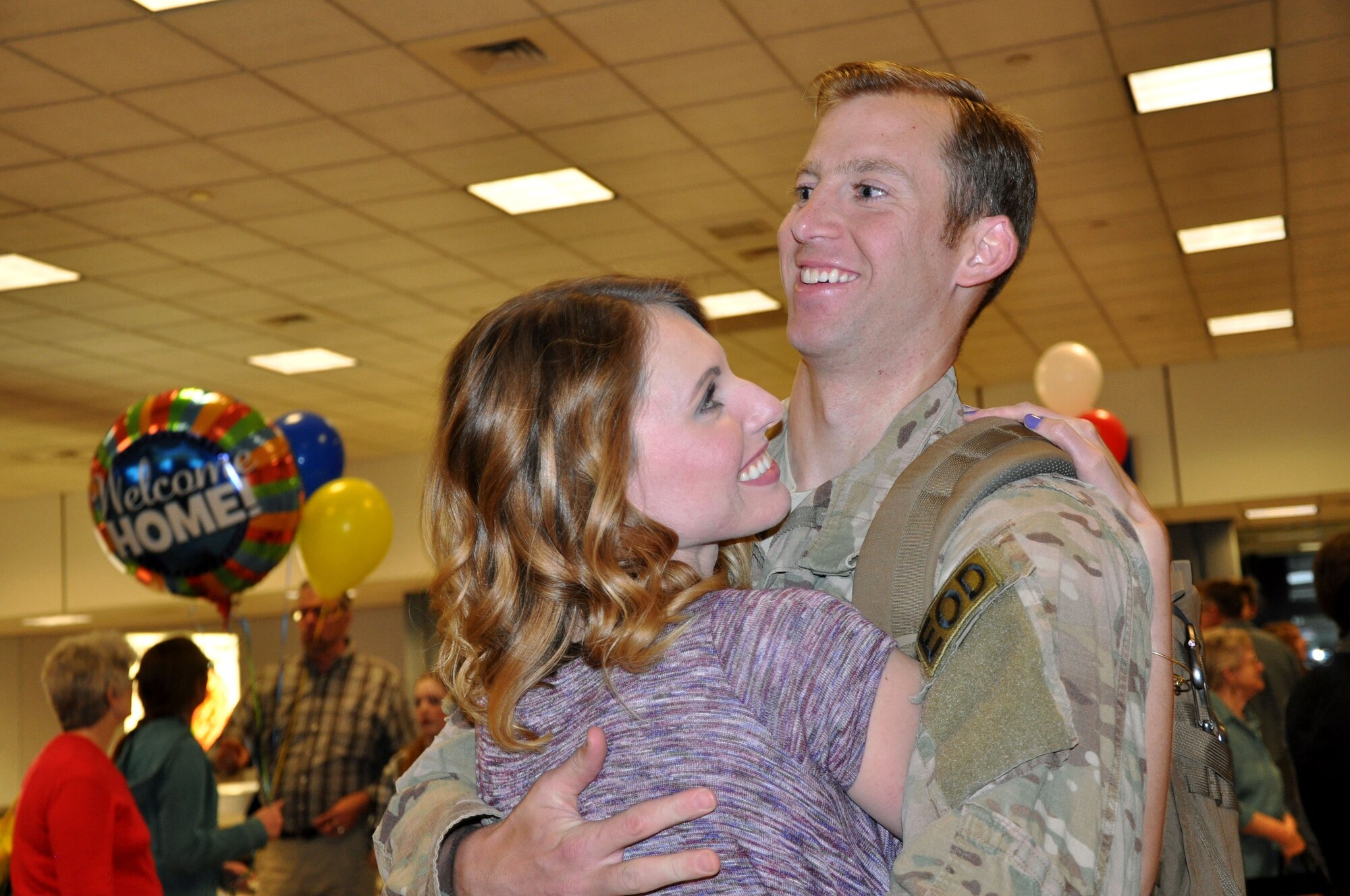 Staff Sgt. Tim Zupancic embraces his wife, Stephanie, after his return from a six-month deployment to Southwest Asia. “We’ve only been married nine months,” Stephanie said. “It’s been a long six months without him.” Zupancic and three other reservists from the 419th Fighter Wing’s explosive ordnance disposal flight returned home April 27. (U.S. Air Force photo/Bryan Magaña)
 
