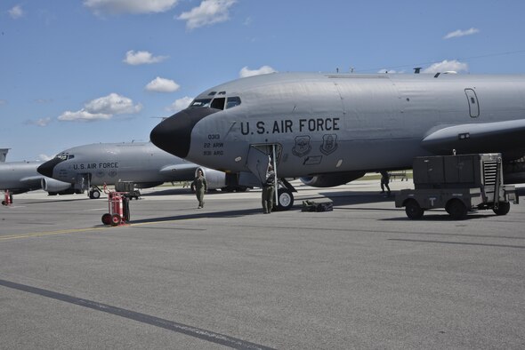 Crew members from McConnell Air Force Base, Kan., unload their KC-135 Stratotankers on April 26, 2016, at Fairchild AFB, Wash. Six KC-135s along with 36 crew members from McConnell AFB evacuated to Fairchild AFB due to projected severe weather. (U.S. Air Force photo/Airman 1st Class Taylor Bourgeous) 