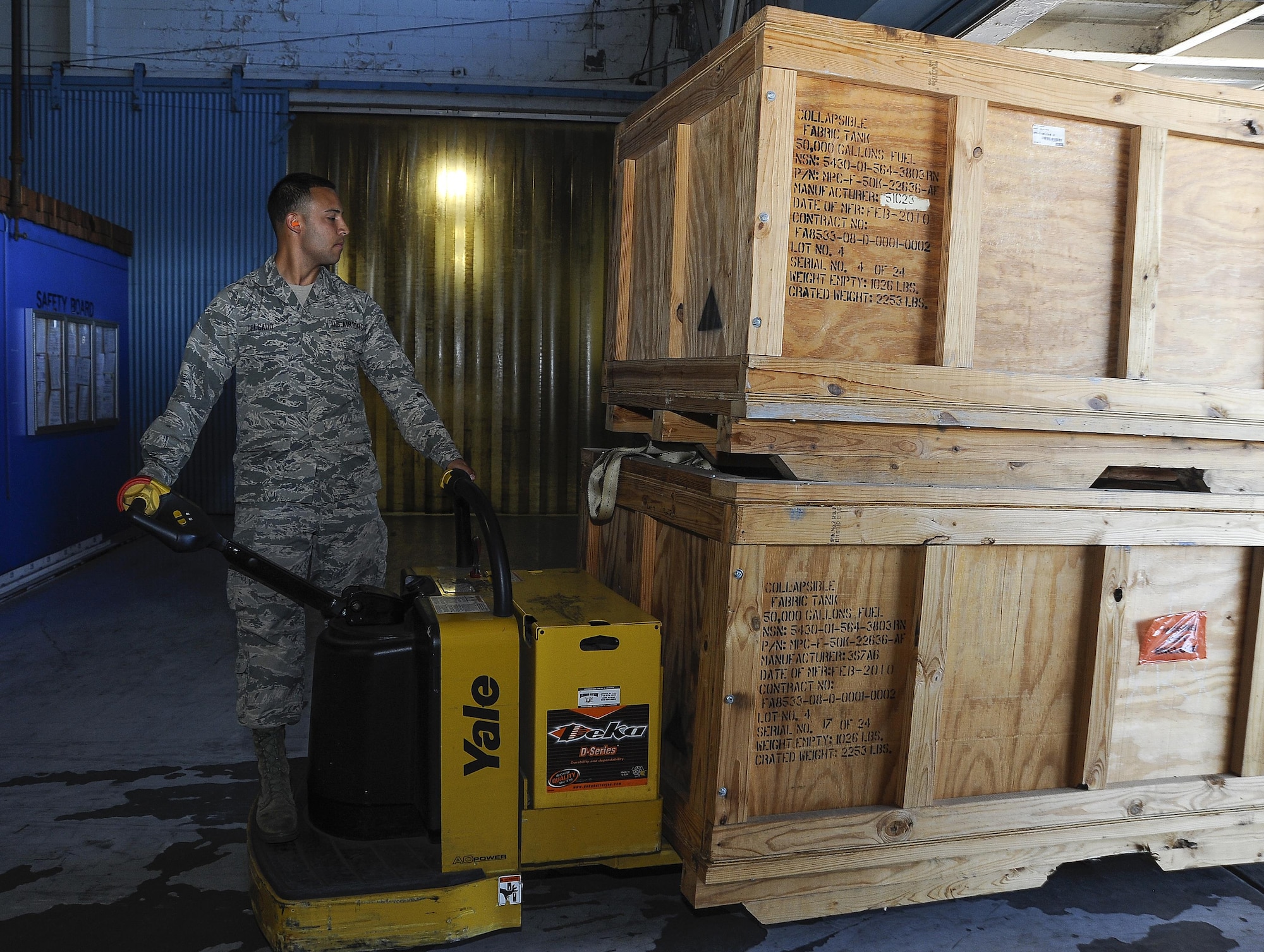 Senior Airman Fabian Delgado, a traffic management journeyman with the 6th Logistics Readiness Squadron, transfers crates on MacDill Air Force Base, Fla., April 19, 2016. The crates contain war reserve materiel, which is prepositioned in reserve for times of need. Since the 49th Materiel Maintenance Support Squadron’s Operating Location Alpha moved from MacDill AFB to Holloman AFB, N.M., in 2015, excess materiel has been transported throughout the world. (U.S. Air Force photo/Airman 1st Class Mariette Adams) 