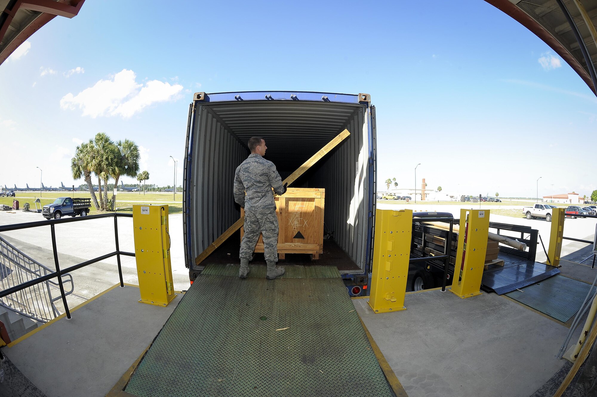 Airman 1st Class William West, a traffic management journeyman with the 6th Logistics Readiness Squadron, secures wood bars to a container at MacDill Air Force Base, Fla., April 21, 2016. In the past few months, a total of 53 war reserve materiel crates were transported from MacDill AFB to areas across the world. (U.S. Air Force photo/Airman 1st Class Mariette Adams) 