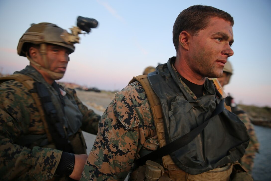 Cpl. Raymond Buckley, right, a reconnaissance man with Company A, 1st Reconnaissance Battalion, 1st Marine Division, prepares for an amphibious operations training exercise during an Expeditionary Operations Training Group course at Camp Pendleton April 21, 2016. Buckley said the importance of rehearsing amphibious operations ahead of time is because it serves as the foundation for the 11th Marine Expeditionary Unit deployment and future operations. (U.S. Marine Corps Photo by Cpl. Demetrius Morgan/RELEASED)