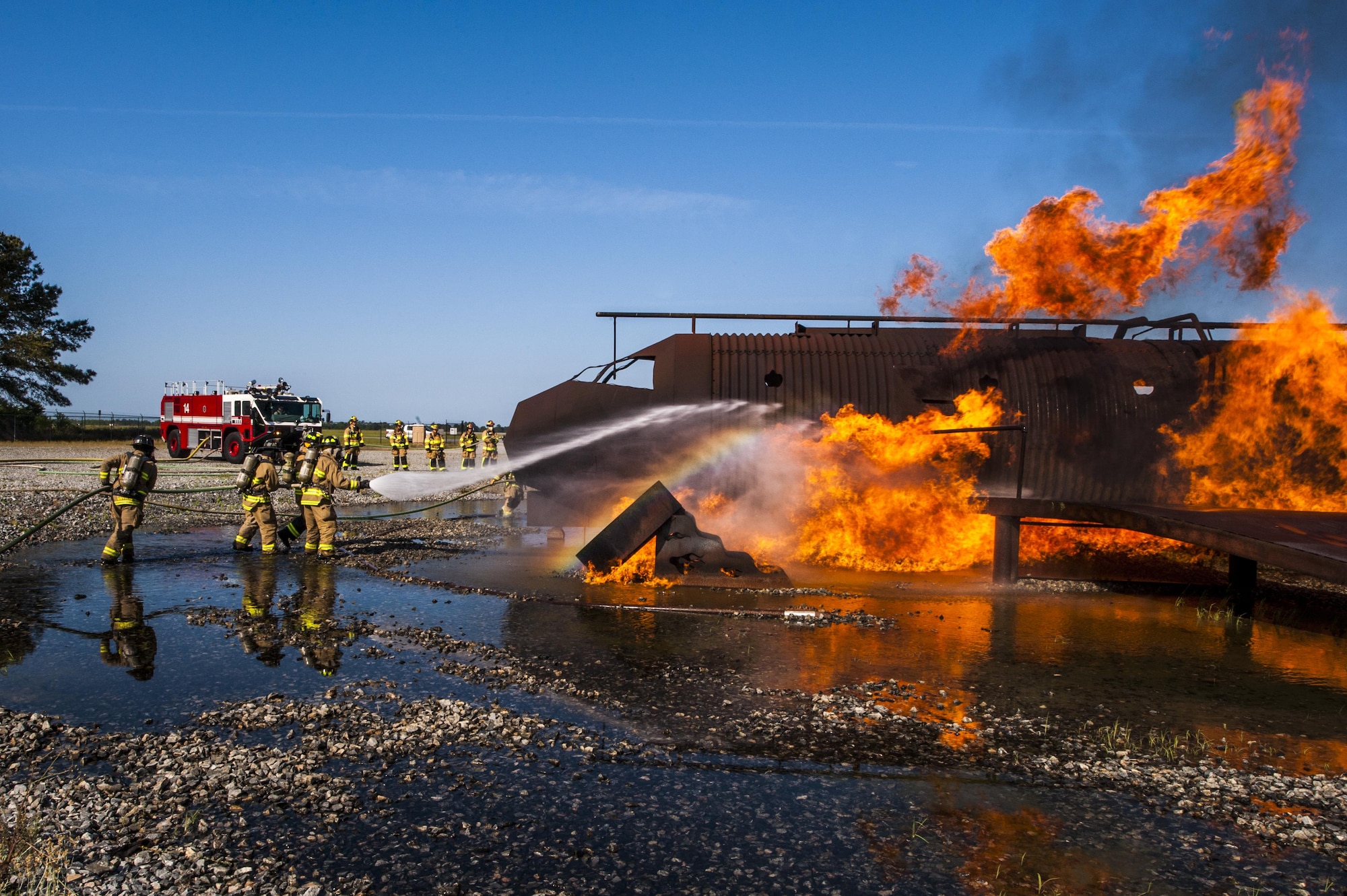 Firefighters from the 23d Civil Engineer Squadron and the Valdosta Fire Department extinguish a fire during aircraft live fire training, April 26, 2016, at Moody Air Force Base, Ga. Moody’s firefighters maintain a working relationship with the VFD in order to know what to expect from each other when combatting a fire together in a real world situation. (U.S. Air Force photo by Airman 1st Class Lauren M. Hunter/Released)