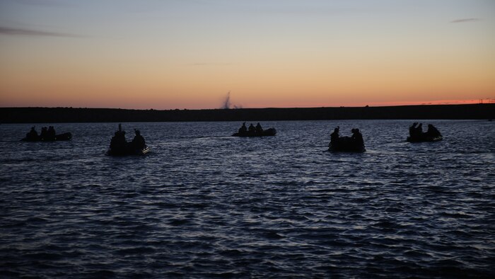 Marines with Company A, 1st Reconnaissance Battalion, 1st Marine Division, advance to their objective during an amphibious operations training exercise as part of an Expeditionary Operations Training Group course at Marine Corps Base Camp Pendleton, California, April 21, 2016. The Marines conducted beach surveys from designated positions in the ocean, where they observed and reported information to their headquarters team.