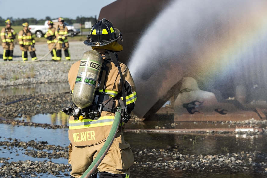 U.S. Air Force Tech. Sgt. Stephen Weaver, 23d Civil Engineer Squadron fire protection station chief, extinguishes an aircraft fire, April 26, 2016, at Moody Air Force Base, Ga. Moody’s fire department teams up with the Valdosta Fire Department twice a year to remain proficient on procedures and techniques used to put out aircraft fires. (U.S. Air Force photo by Airman 1st Class Janiqua P. Robinson/Released)