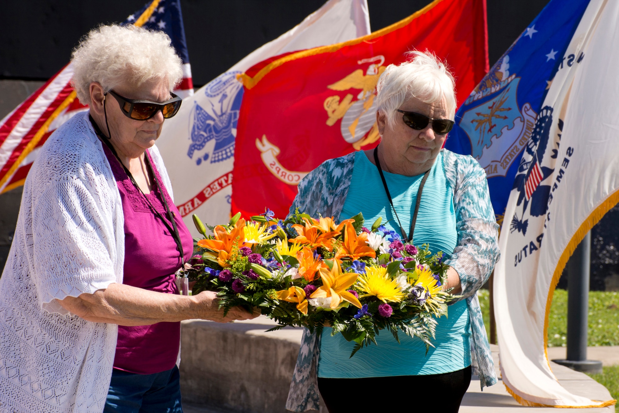 (Left) Cheryl Beckett and Barbara Smith prepare to put a wreath into the water in memory of the dead during the “All Cavalla Reunion Memorial Service” at Seawolf Park in Galveston, Texas, Apr. 23, 2016. Both women are spouses of former Cavalla crewmembers. The bi-annual reunion is an opportunity for former crewmembers of the USS Cavalla SS - SSK - AGSS – 244 and USS Cavalla (SSN 684) to reconnect with each other, make new friends, share sea stories and honor the memory of those submariners who have passed. U.S. Air Force Reserve Master Sgt. Jeff Walston, a public affairs technician assigned to the 913th Airlift Group at Little Rock Air Force Base, Ark., served on the USS Cavalla (SSN 684) from 1977 to 1979, while he was in the U.S. Navy. (Courtesy photo by Jeff Walston)