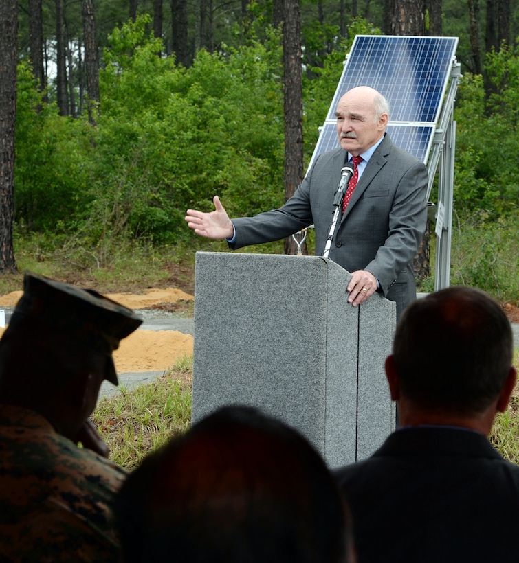 The Honorable Dennis V. McGinn, assistant secretary of the Navy for Energy, Installations & Environment, speaks to attendees during a ground breaking ceremony for a large-scale solar facility held aboard the installation, April 28.
