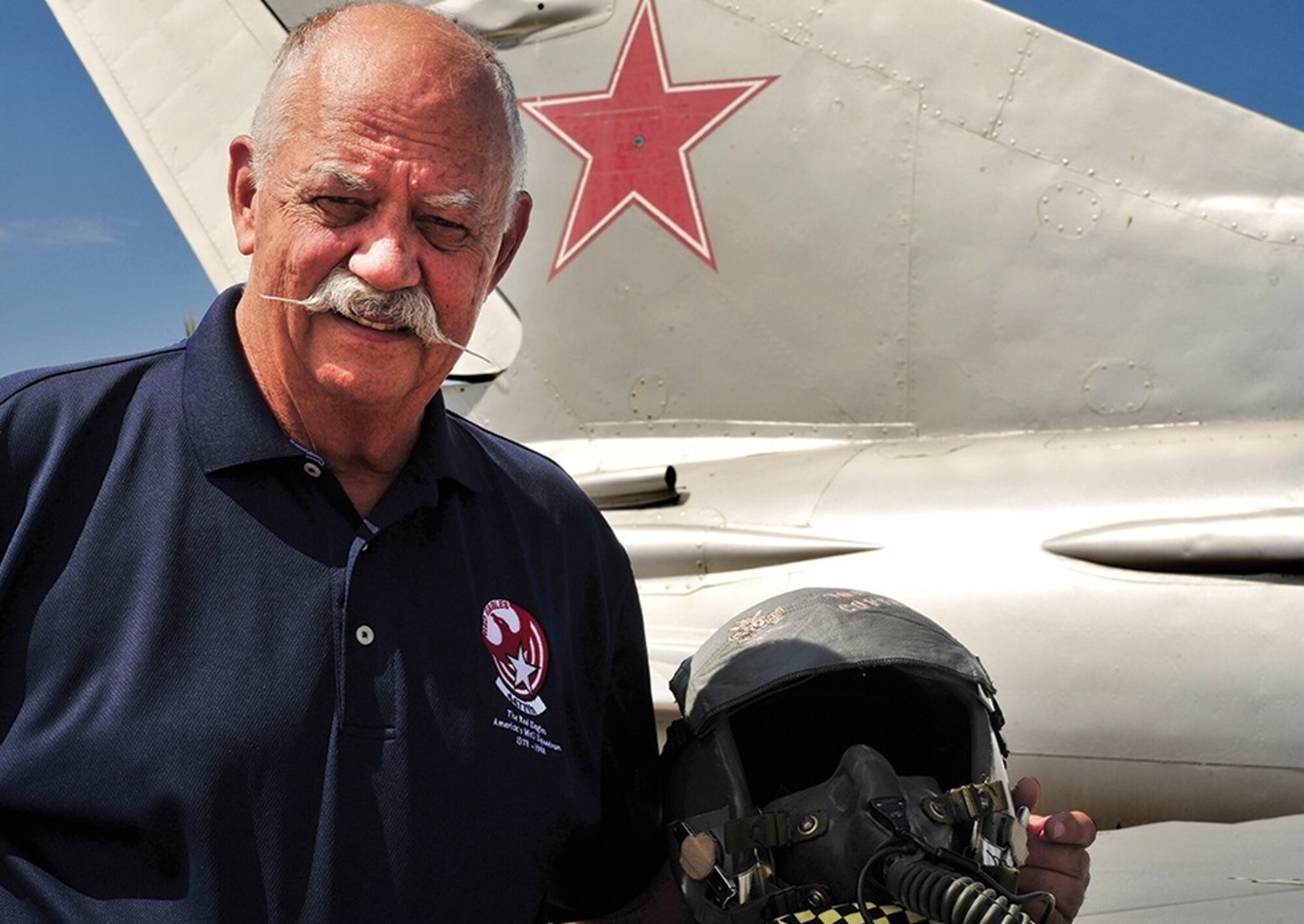 Colonel (Ret.) Gaillard Peck Jr. changed history when he co-founded the MiG operation at Tonopah, Nev., paving the way for more than 6,000 Airmen, Sailors and Marines to fight the MiG-17, MiG-21 and MiG-23 in combat operations overseas.  He started his aviation career at age 16, flying in the backseat of a T-38 with his father, an Army Air Corps officer who later transitioned to the newly created U.S. Air Force.  Peck received his commission from the Air Force Academy in 1962.  During his time as a fighter pilot in the 8th Tactical Fighter Wing at Ubon Royal Thai Air Force Base, Thailand, in the 433rd Tactical Fighter Squadron, he flew 163 combat missions in Vietnam and Laos.  Peck served as the vice commander of the 18th Wing at Kadena AB, Japan, and later commanded the 26th Tactical Reconnaissance Wing at Zweibrucken AB, Germany.  Peck’s most cherished lesson from his Air Force career is that it provided sound values and understanding of MacArthur’s famous speech on duty, honor and country.  Peck currently serves as the subject matter expert for the Air Force Weapons School at Nellis AFB, Nev.