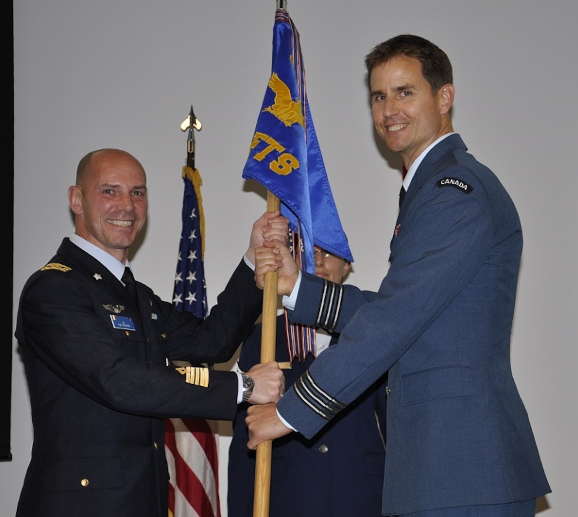 Lieutenant Colonel Rhett Chambers assumes command of the 89th Flying Training Squadron  in a ceremony at the 80th Flying Training Wing, Sheppard Air Force Base, Texas, April 22, 2016. The ceremony represents the first time in the 35-year history of the Euro-NATO Joint Jet Pilot Training Program that a Canadian Air Force officer has been appointed to a squadron command position. On 31 Mar 2008, the 89th officially received the first deliveries of the Air Force's newest primary trainer, the T-6A, which replaced the T-37 'Tweet' aircraft.  The 89th FTS presently instructs almost 250 ENJJPT pilots annually in primary jet training in the Hawker Beechcraft T-6A "Texan II." The ENJJPT Program has produced over 7,100 pilots for the NATO alliance. Lt. Col. Chambers is a combat pilot with 4,000 flying hours, including 330 amassed during 75 combat missions in Afghanistan.  

(USAF photo/Debi Smith)
