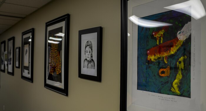 Art by Dr. Anakawa, 99th Medical Operations Squadron internal medicine doctor, hangs on the wall of the internal medicine section of the Mike O'Callaghan Federal Medical Center during his “An Art of An Art” exhibit at Nellis Air Force Base, Nev., April 21, 2016. The internal medicine section of the Mike O’Callaghan Federal Hospital held an art exhibition, “An Art of an Art,” containing ten years of Dr. Anakwa’s work, but not only is this artwork used for display, it’s an integral tool for communicating with patients. (U.S. Air Force photo by Airman 1st Class Kevin Tanenbaum)