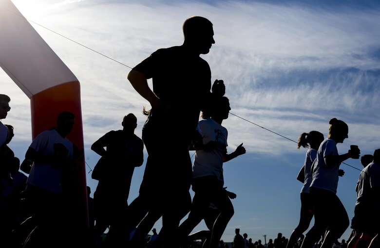 Participants of the 5K Color Run/Walk begin the race at Nellis Air Force Base, Nev., April 22, 2016. Several base agencies were on hand to offer information on their services. (U.S. Air Force photo by Airman 1st Class Nathan Byrnes)