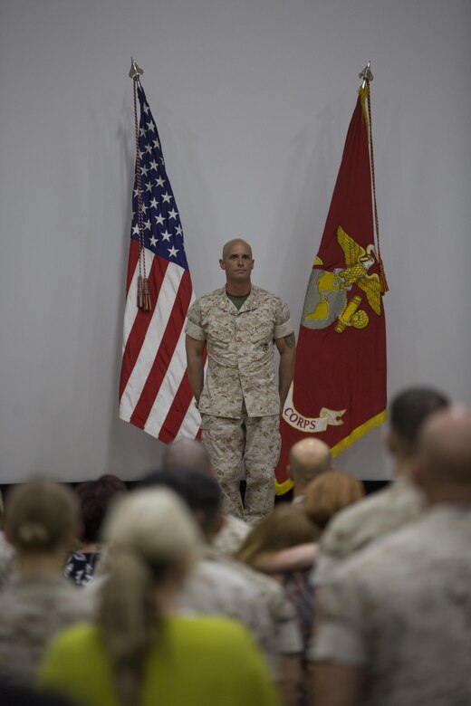 Maj. Chad E. Craven, commanding officer, Delta Company, Communication Training Battalion, stands at the position of attention during the playing of the “Marines’ Hymn” during his retirement ceremony at the base theater April 20, 2016. Craven retired after 24-years of honorable service. (Official Marine Corps photo by Cpl. Julio McGraw/Released)