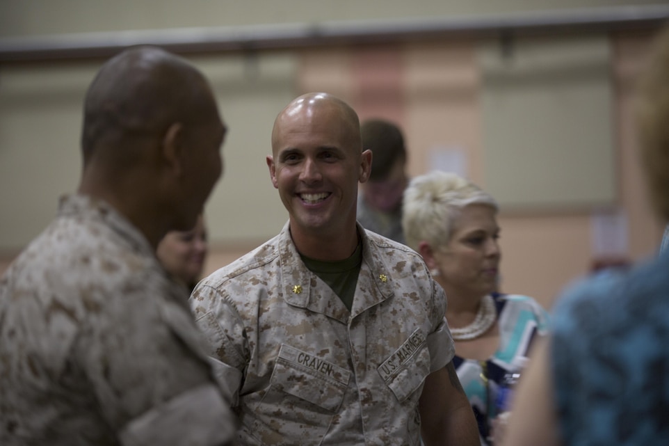 Maj. Chad E. Craven, commanding officer, Delta Company, Communication Training Battalion, talks to friends and collegues after his retirement ceremony at the base theater April 20, 2016. Craven retired after 24-years of honorable service. (Official Marine Corps photo by Cpl. Julio McGraw/Released)