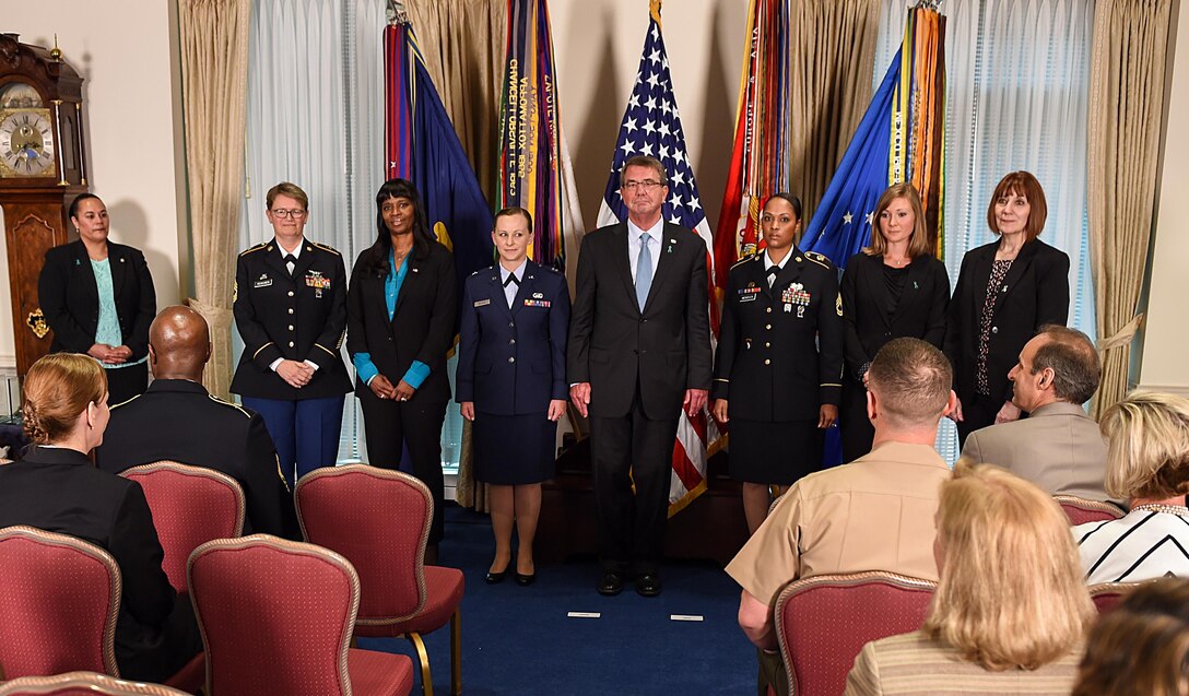 Defense Secretary Ash Carter poses with the sexual assault response coordinators of the year during a ceremony at the Pentagon today. The recipients are, from left, Army Master Sgt. Melinda Heikkinen, Coast Guard civilian Simone Hall, Air Force Capt. Elizabeth Belleau, Army Sgt. 1st Class Raquel Mendoza, Marine Corps civilian Jacqueline Maxwell, and Navy civilian Deborah Drucker. DoD photo by Army Sgt. 1st Class Clydell Kinchen