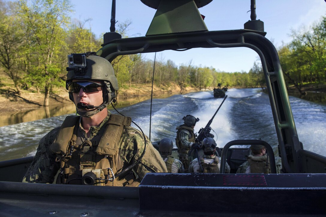 Navy Petty Officer 3rd Class Joseph Camp navigates a waterway during an annual training exercise at Fort Knox, Ky., April 17, 2016. The coastal riverine force is a core Navy capability that provides port and harbor security, high value asset protection, and maritime security operations in coastal and inland waterways. Navy photo by Petty Officer 2nd Class Gabriel Bevan
