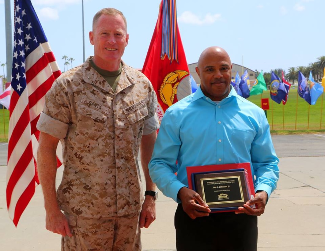 Brig. Gen. Edward D. Banta, Commanding General, Marine Corps Installations - West, Marine Corps Base Camp Pendleton, awards Joe Fitts a Federal Length of Service Award for 35 years of federal service at the Civilian Awards Ceremony aboard Camp Pendleton, April 28, 2016. The Civilian Awards Ceremony was held to recognize 13 Camp Pendleton civilian employees for Federal Length of Service Awards and one for a Professional Housing Management Association Award.

Link to photos: https://www.dvidshub.net/image/2557514/camp-pendleton-hosts-civilian-awards-ceremony
