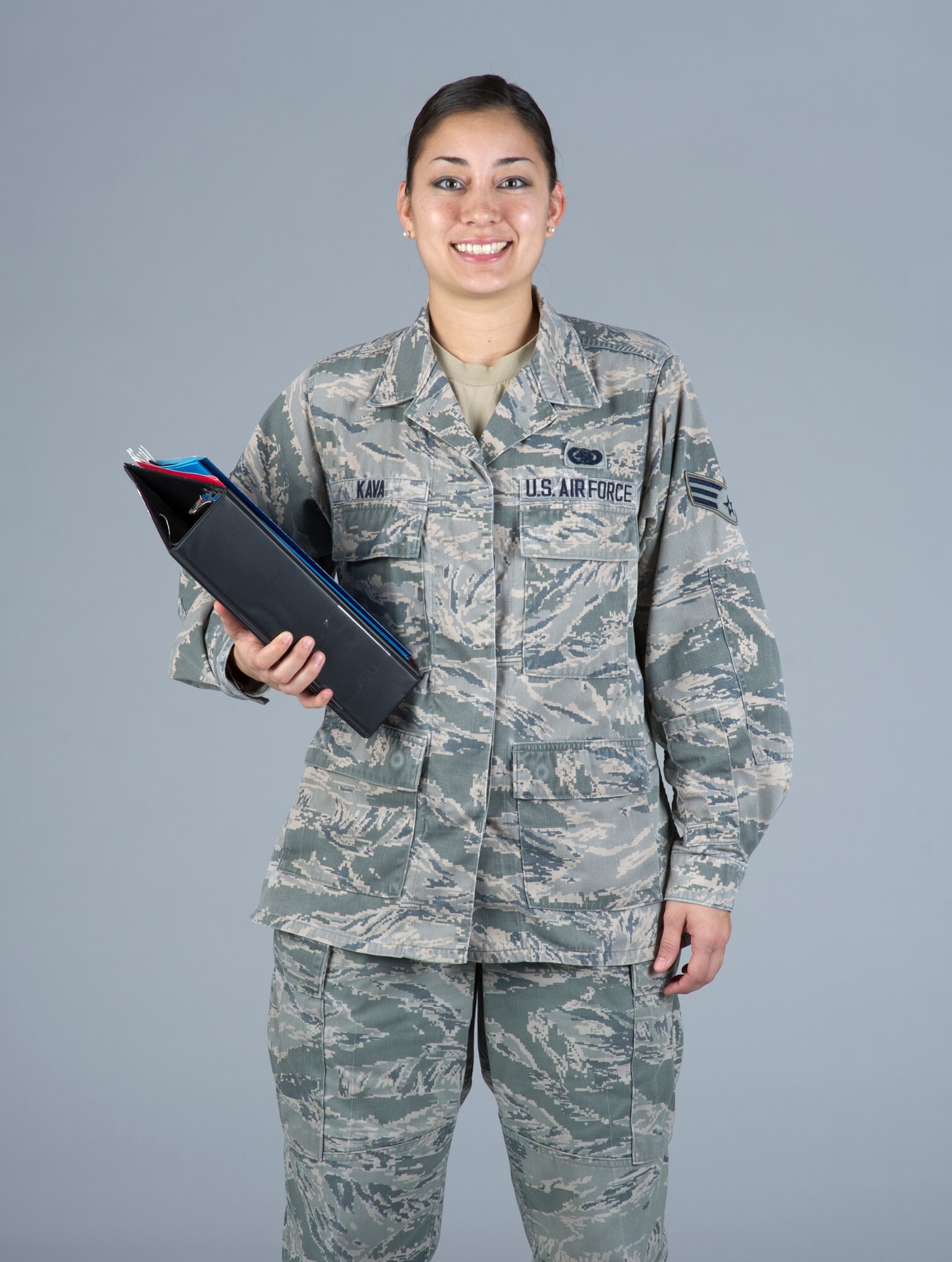 Senior Airman Cinnamon Kava, 60th Logistics Readiness Squadron decentralized supply support, poses for a photo in December 2014 at Travis Air Force Base, Calif. 