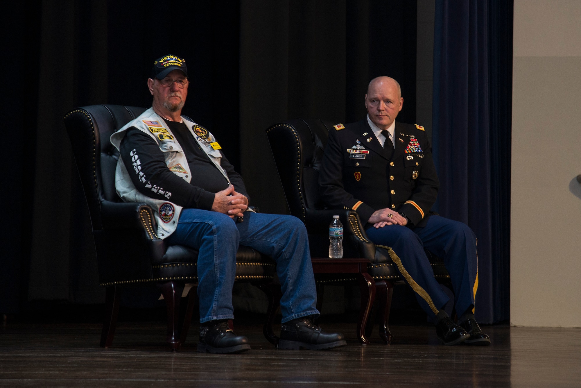 Retired Army SGT. Cecil Wade and Army Col. Kevin Lynch, wait for the presentation listen to a speech given about Wade’s brave actions in Vietnam, April 22, 2016 at Scott Air Force Base, Illinois. Wade left his bunker while under intense enemy fire to reach a forward command post lead by his platoon leader.  Without hesitation or concern for his own safety, Wade and his friend “Mouse” moved through the enemy fire to retrieve more ammunition for his comrades, then continued to defend the perimeter until the enemy’s attack was successfully repulsed. (Air Force photo by Airman 1st Class Gwendalyn Smith)