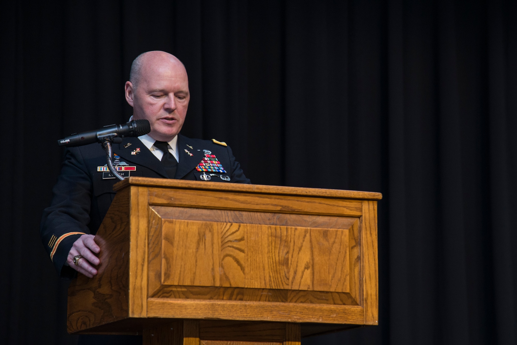 Army Col. Kevin Lynch, gives opening remarks during a ceremony April 22, 2016 at Scott Air Force Base, Illinois. Lynch presented Retired Army SGT. Cecil Wade with three medals: The Army Commendation Medal with Valor, a second bronze star device for his Vietnam Service Medal, and a Purple Heart for wounds received in combat against an armed enemy of the United States. (Air Force photo by Airman 1st Class Gwendalyn Smith)