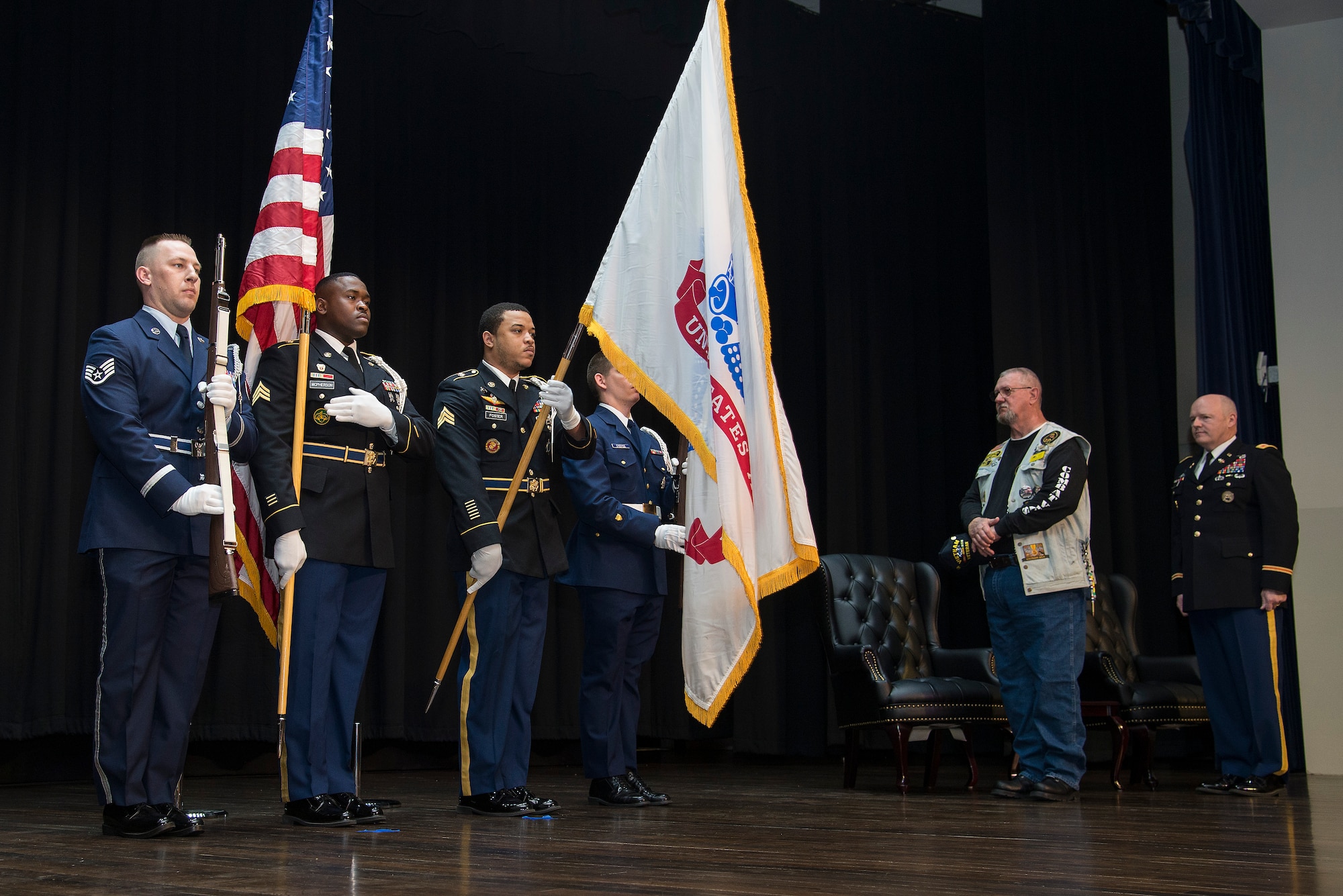 Retired Army SGT. Cecil Wade stands during the presentation of the flag April 22, 2016 at Scott Air Force Base, Illinois. Wade was presented with three medals: The Army Commendation Medal with Valor, a second bronze star device for his Vietnam Service Medal, and a Purple Heart for wounds received in combat against an armed enemy of the United States. (Air Force photo by Airman 1st Class Gwendalyn Smith)