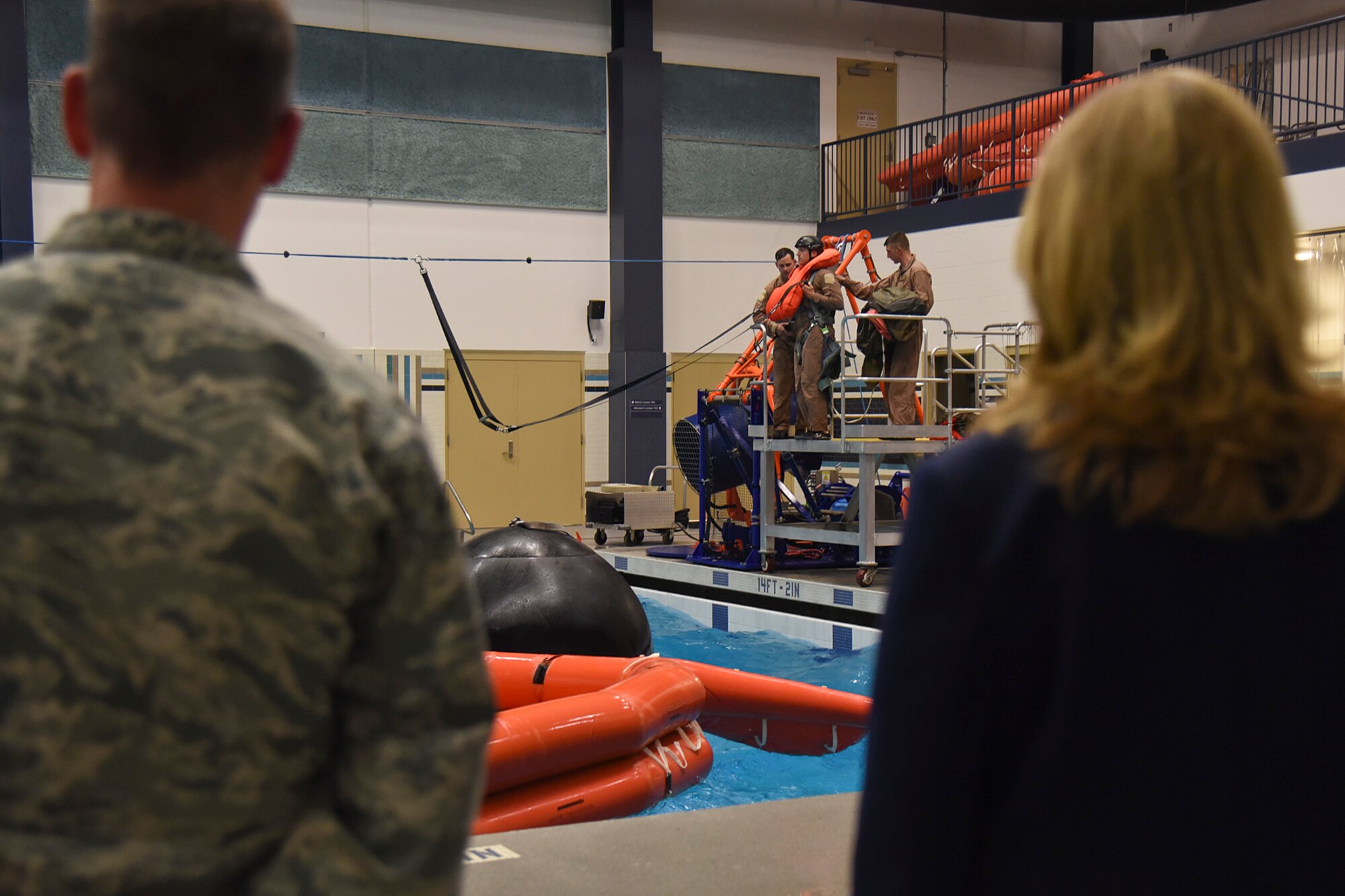 The Honorable Deborah Lee James, Secretary of the Air Force, observes 336th Training Group Survival, Evasion, Resistance and Escape instructors demonstrate a variety of parachuting situations April 27, 2016, at Fairchild Air Force Base pool. SERE instructors also demonstrated water survival training and various survival techniques. (U.S. Air Force photo/Airman 1st Class Mackenzie Richardson)