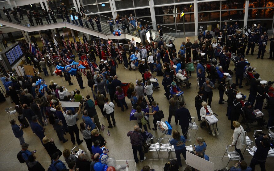 World War II Veterans arrive at the SeaTac atrium for their “Welcome Home Celebration” during a United Services Organizations Honor Flight event April 25, 2016 at the SeaTac International Airport, Wash. More than 500 family, friends and bystanders applauded and cheered as the Veterans entered the atrium. (U.S. Air Force photo/Senior Airman Divine Cox)