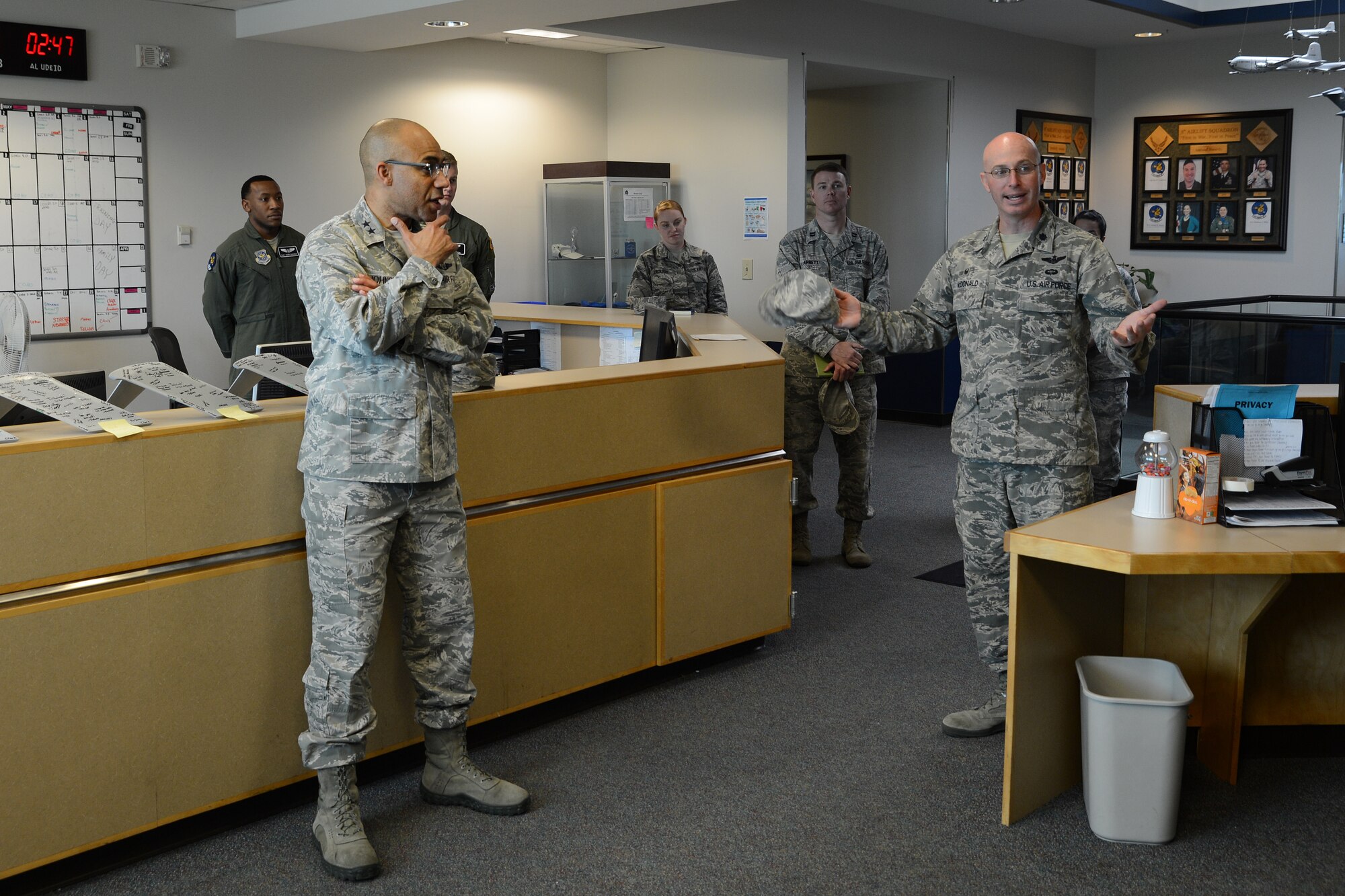 Maj. Gen. James Johnson (left), Air Force Sexual Assault Prevention and Response Office director, talks to Airmen from the 8th Airlift Squadron about his time working in the squadron as a navigator. Johnson served as a navigator and director of quality at the 8th AS from April 1994 to Jan. 1995. (U.S. Air Force photo/Senior Airman Jacob Jimenez)  
